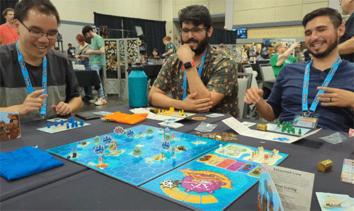 Players laughing and discussing how they plan to attack each other.